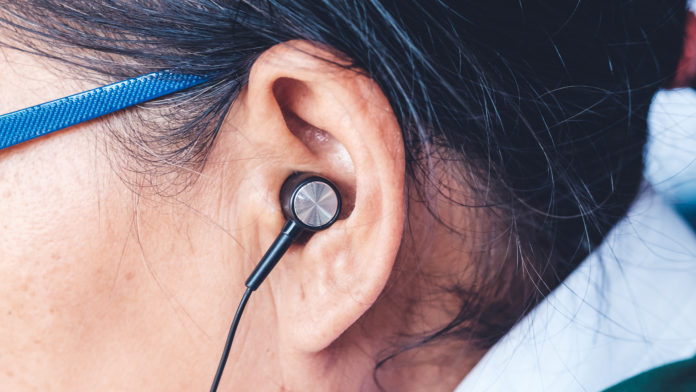 Ears and wear the headphones. Seniors active