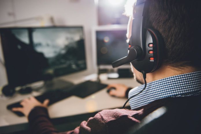 man playing on computer