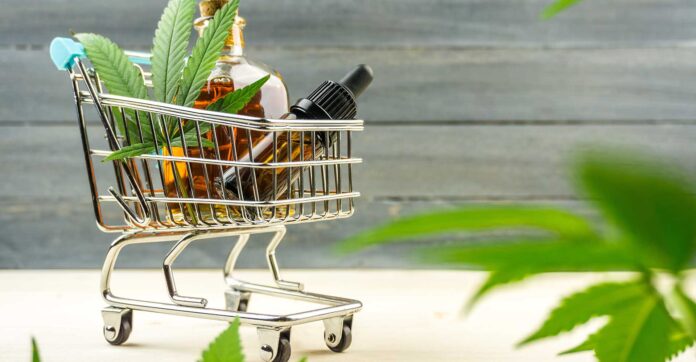 Supermarket trolley with marijuana leafs and medical cannabis oi