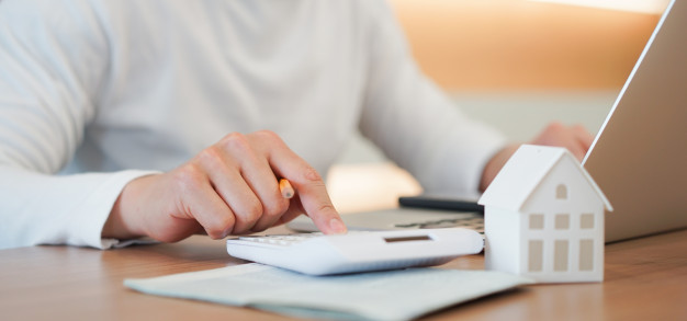 man-hand-press-calculator-check-summary-expense-home-loan-mortgage-refinance-plan