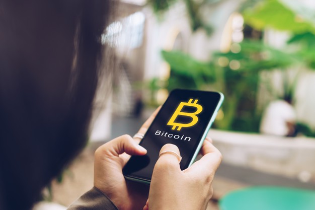 woman-use-gadget-mobile-smartphone-earn-money-online-buy-bitcoin-with