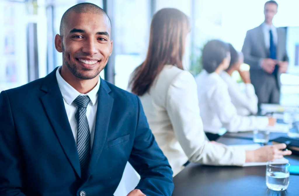 Businessman smiling at the camera. Depiction of finance directors