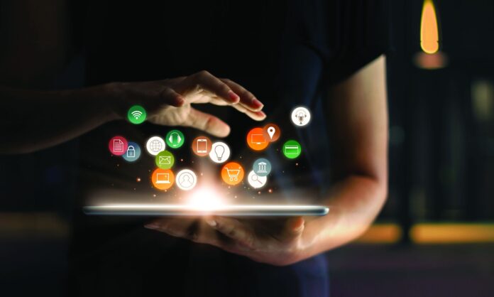 Digital online marketing commerce sale concept. Woman using tablet payments online shopping and icon customer network connection on hologram virtual screen, m-banking and omni channel.