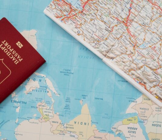 Passport on a world map. Concept for Citizenship by Investment