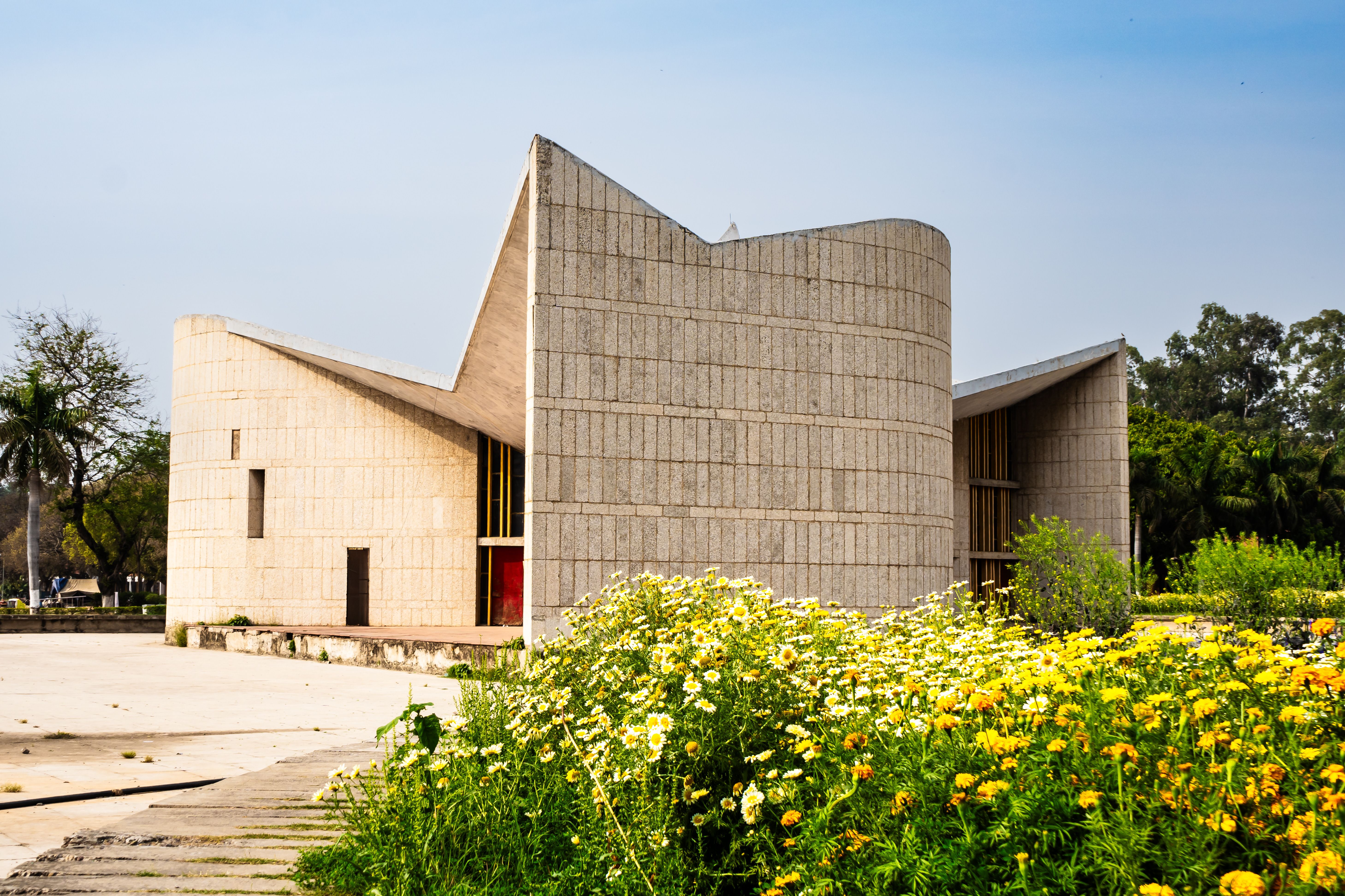 Modern concrete architecture surrounded by marigolds in Chandigarh, India